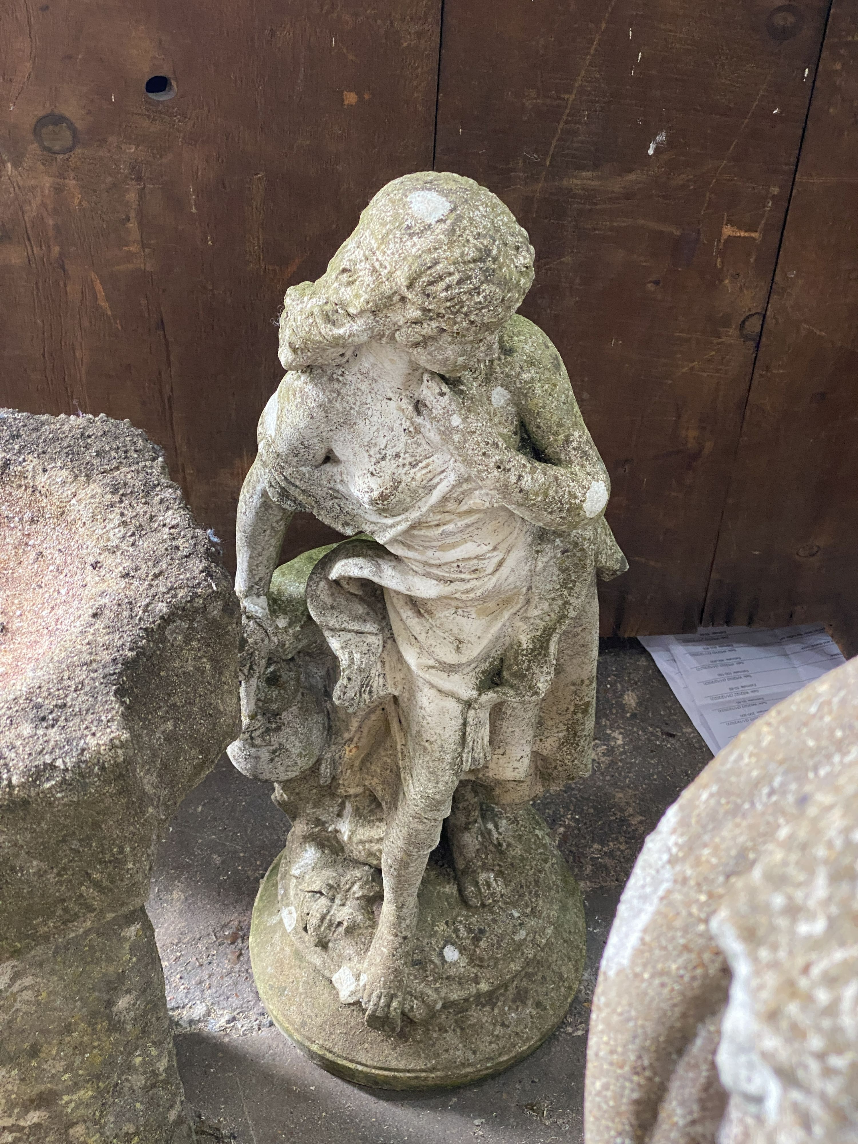 A reconstituted stone figural sundial, a female bather figure, bird bath and one other garden ornament, largest height 98cm